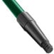 A green threaded tube with a black handle.