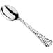 a silver spoon on a white background