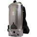 An Atrix cordless backpack vacuum with a black strap.