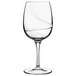 A clear Luigi Bormioli white wine glass with a curved shape.