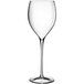 A close-up of a Luigi Bormioli Magnifico clear wine glass with a long stem.