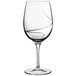 A clear Luigi Bormioli Aero wine glass with a curved design.