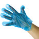 A person's hand wearing a blue AeroGlove.