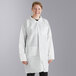 A woman wearing a Malt Impact white disposable lab coat.