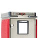 A metal box with red and silver accents and a door.