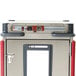 A close-up of a Metro T Series holding cabinet with a red door and handle.
