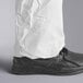 A person wearing white Malt Impact ProMax coveralls.