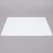 A white rectangular Tablecraft flexible cutting board.