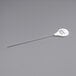 A long thin metal needle with a white handle and black text that says "Choice 7 5/8" Cake Tester"