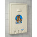 A white plastic Koala Kare baby changing station with a koala bear logo on it.