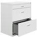 A white Hirsh Industries lateral file cabinet with drawers.