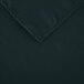 A hunter green rectangular cloth table cover with a folded edge.