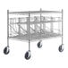 A Regency chrome wire cart with four can racks on wheels.