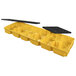 A yellow and black plastic spill containment platform.