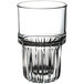 A close up of a Libbey highball glass with a curved rim.