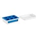 A blue and white plastic OXO Good Grips ice cube tray with four compartments.