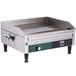 A Waring stainless steel countertop electric griddle on a counter.