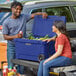 a man and woman sitting in a cooler