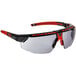 A pair of Honeywell safety glasses with red frames and gray lenses.