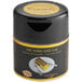 A black container of 24K Edible Gold Crumbs with a gold label.