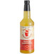 A bottle of Top Hat Provisions Passion Fruit Margarita Mix with a yellow label and liquid.