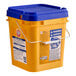 A yellow bucket with blue handles and a blue lid containing Arm & Hammer Crisp Clean HE Powder Laundry Detergent.