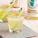 Two glasses of Top Hat Provisions Classic Tonic with cucumber and orange slices.