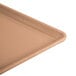 A close-up of a dark peach Cambro dietary tray.