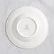 A white RAK Porcelain deep plate with an embossed crown logo.