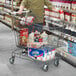 A man pushing a Regency Supermarket gray shopping cart in a grocery store aisle.
