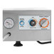 A stainless steel electric meat and vegetable vacuum marinator with control dials and a vacuum gauge.