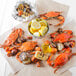 A plate of extra seasoned steamed Chesapeake Blue Crab with corn on the cob.