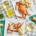 A plate of Chesapeake Crab Connection steamed female crab and potatoes on a table.