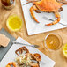 a plate of crab and two glasses of liquid
