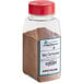 A clear jar of Regal Spicy Chai seasoning with brown powder in it.