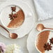 A cup of coffee with Regal Spicy Chai seasoning and star anise.