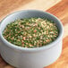 A bowl of Regal Meatloaf seasoning on a wooden table.