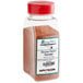 A plastic container with a white label and red lid of Regal Mexican Chorizo Sausage Seasoning.