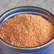 A bowl of Regal Mexican Chorizo Sausage seasoning powder.