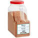 A plastic container of Regal Mexican Chorizo Sausage Seasoning with brown powder inside.