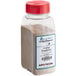 A clear container of Regal Original French Fry Seasoning with a red lid and label.