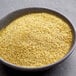 A bowl of yellow powder.
