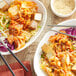 A bowl of Lucky Foods Spicy Vegan Kimchi with chopsticks.