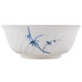 A white melamine bowl with blue bamboo designs.