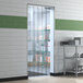 Clear plastic Lavex door strips on a door.
