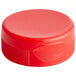 a red plastic cap with a lid