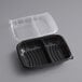 A black plastic container with clear plastic lid with two compartments.