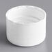 A white plastic 24/410 continuous thread lid with foam liner.