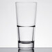 A close-up of a Libbey stackable beverage glass with a drop of water inside.