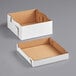 Two white corrugated bakery boxes, one open and one closed.